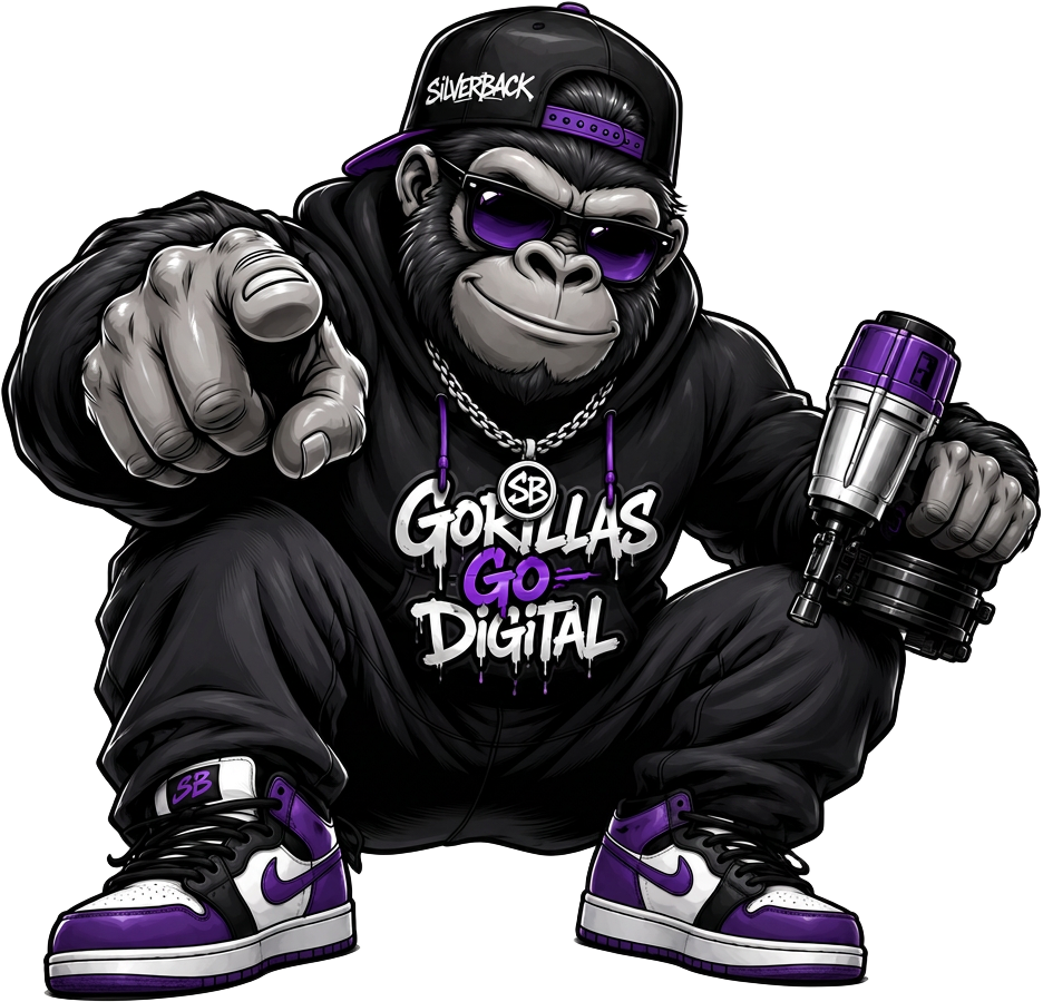 The Silverback mascot pointing at you — backward cap, purple sunglasses, silver chain, Gorillas Go Digital hoodie